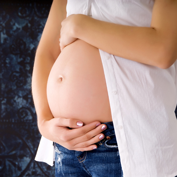 woman holding stomach