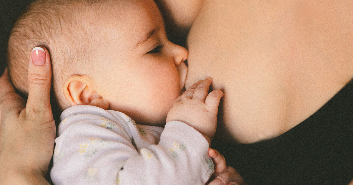 a newborn baby breastfeeding