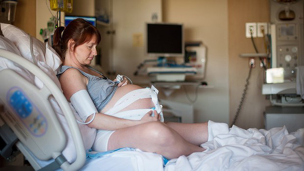pregnant woman in hospital bed